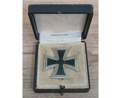 A German Third Reich First Class Iron Cross, marked 595, with associated box.