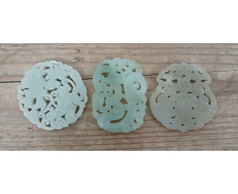 A group of three Chinese jadeite jade carvings, length approximately 5cm each.