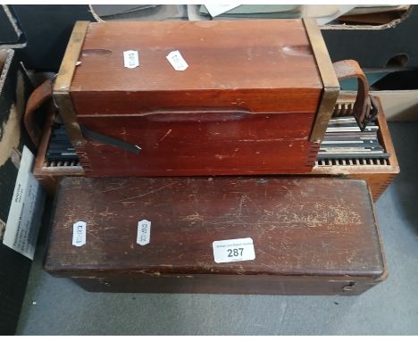 Three wooden boxes of miscellaneous magic lantern slides. 