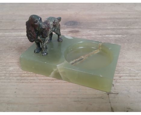 A cold painted bronze dog and onyx pin cushion, length 11cm.