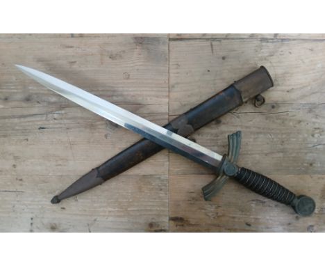 A German Third Reich Luftwaffe dagger and scabbard, the 30.5cm double edge steel blade signed Alcove Solingen, wire bound lea