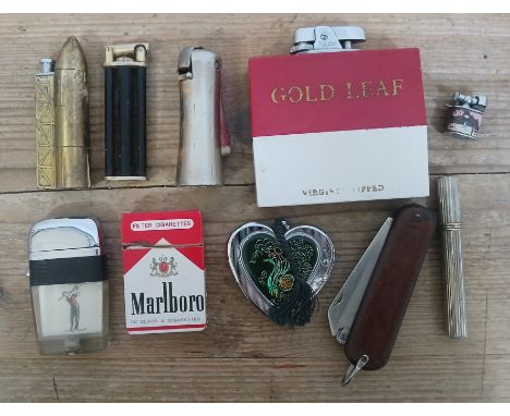 A collection of vintage novelty lighters including a 'pen knife' lighter. 
