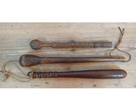 A truncheon, a throwing stick and a tourist type carved shillelagh.