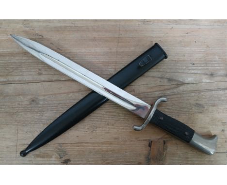 A German Third Reich Fireman's Parade dagger, blade length 24.5cm, metal scabbard and associated leather frog, total length 4