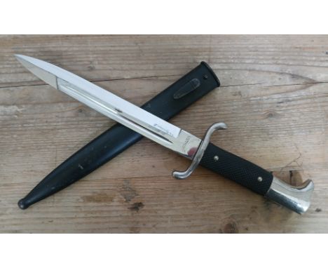 A German Third Reich Fireman's Parade dagger by Statthalter, blade length 20cm, metal scabbard and associated leather frog, t