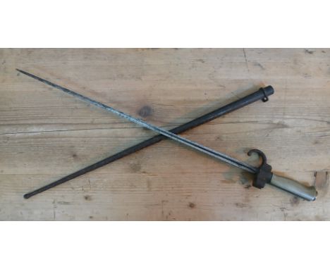 A French M1886/15 cruciform bayonet and scabbard.