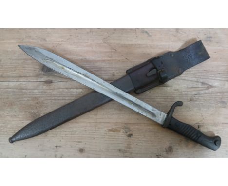 An Imperial German 1898/05 pattern bayonet by AC, blade length 37cm, wooden grip, metal scabbard and leather frog, total leng