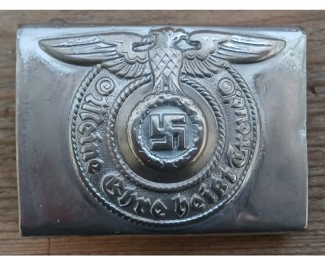 A German Third Reich Waffen-SS belt buckle by Assmann &amp; SÃ¶hne, first steel model circa 1940, stamped RZM 155/40 and SS r