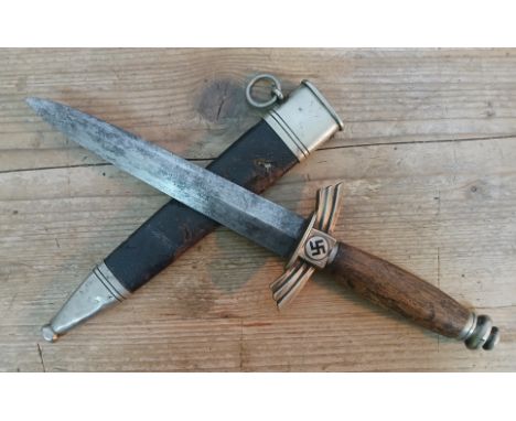 A German WWII DLV Glider Pilot's dagger, double edge steel blade marked SMF Solingen, wood grip, nickel mounted and leather b