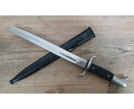 A German Third Reich Fireman's Parade dagger by Puma, blade length 24.5cm, metal scabbard, total length 40.5cm.Condition - Ge