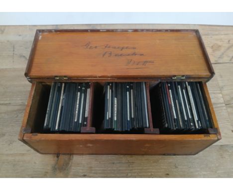 A wooden box containing First World War magic lantern slides. 