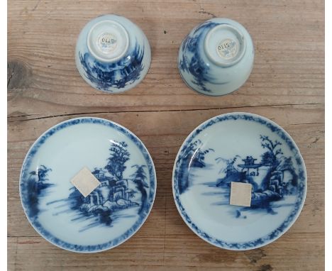 A pair of Chinese 18th century Nanking Cargo blue and white porcelain tea bowls and saucers, Christies label lot 5110.&nbsp;C