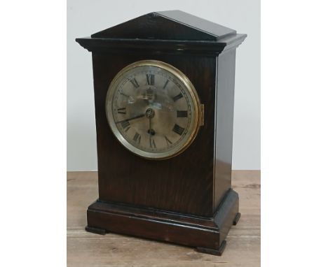 A British WWII period RAF Officer's/Sergeantâ€™s Mess mantle clock, architectural oak case, round silvered steel dial with Ro