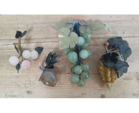 A group of four Chinese jade fruit decorations, length 9cm to 19cm.