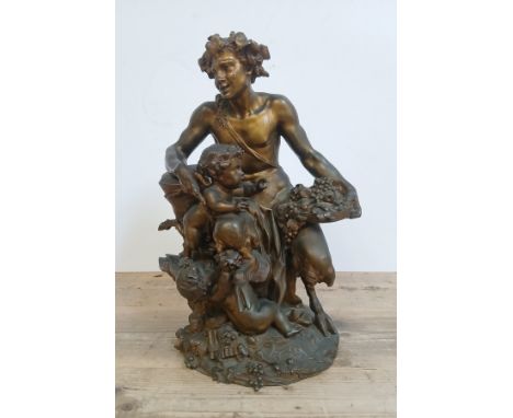 After Claude Michel (1738-1814), known as Clodion, a large gilt bronze depicting Pan seated with two putti, 19th century, sig