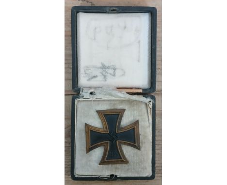 A German Third Reich First Class Iron Cross, marked 595, with associated box.