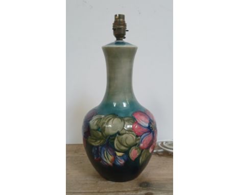 A Moorcroft pottery table lamp decorated in Anemone pattern, height 40cm (including fitting), with shade, not pictured.