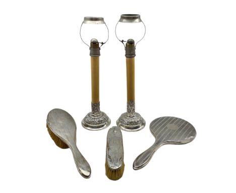 Pair of late Victorian silver candle stands with embossed decoration London 1897, Maker William Comyns, each fitted with a Gr