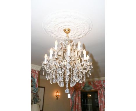 **PLEASE NOTE COLLECTION OF THIS LOT WILL BE FROM BISHTON HALL STAFFORDSHIRE**An eight branch twelve light glass chandelier, 