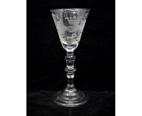 A Dutch engraved Newcastle light baluster, circa 1745, pointed round funnel bowl engraved 'Vriendschap' (Friendship), above a