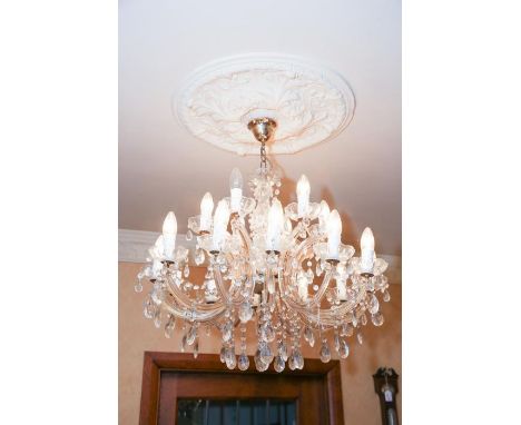 **PLEASE NOTE COLLECTION OF THIS LOT WILL BE FROM BISHTON HALL STAFFORDSHIRE**A moulded glass twelve branch/eighteen light el