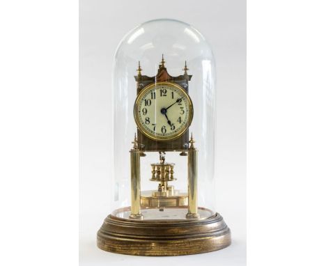 Gustav Becker Torsion or 400 day clock under dome. Small dial with arabic numerals together with key and sales label.Conditio