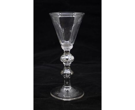 A Georgian light baluster wine glass, circa 1740, conical bowl set on an annulated collar, above an air beaded drop knop and 