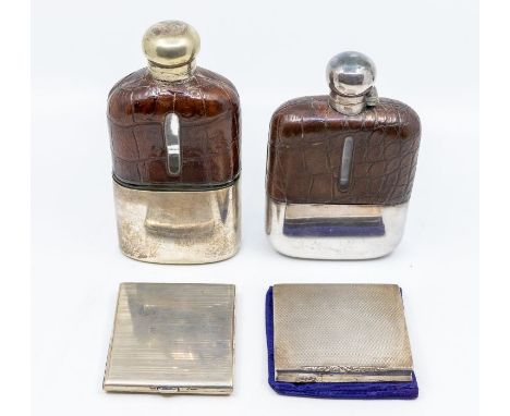 Two early 20th Century glass, crocodile leather and electro plated hip flasks, the larger example with detachable cup, both s
