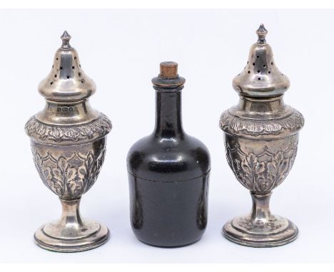 A pair of Edwardian silver pepper pots, domed pierced covers, urn shaped bodies chased with acanthus leaves, hallmarked Mille