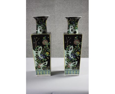 A pair of early 20th century Famille Noir square four seasons hand painted porcelain vases. Kangxi marks to base. H.42 W.12 D
