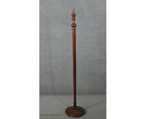A mid century vintage mahogany standard lamp with faceted column on platform base. H.158 Diam.30 cm 