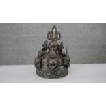 An early 20th century steel Tibetan oracle skull crown with flame motifs. Worn to ward away evil