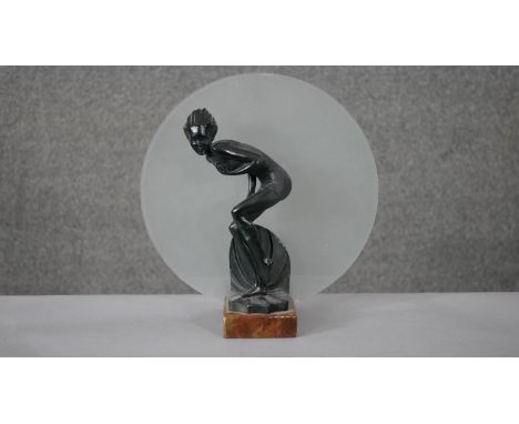 An Art Deco spelter bather figural lamp on marble base with frosted disc shade. Diam.30 D.12cm 