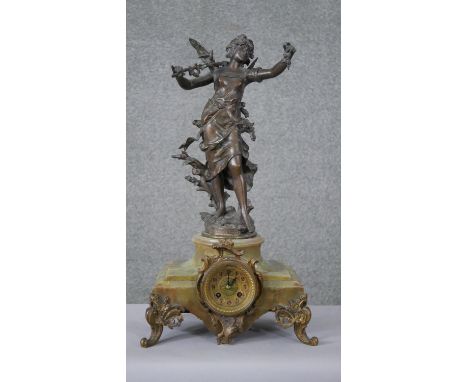 After Louis Moreau- A spelter and alabaster mantle clock with sculpted winged nymph to the top (wing damaged), brass plaque w