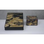 Two Japanese gilded lacquered boxes. One a tea caddy with partitions decorated with a village