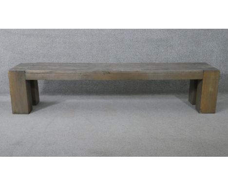A planked top bench on block supports. H.45 W.204 D.41 cm 