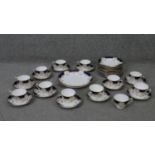 A Crown Staffordshire fine china royal blue and gold twelve person hand painted part tea set.