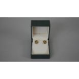 A pair of French 19th century seed pearl and blue enamel 18 carat yellow gold stud earrings.