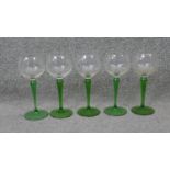 A set of five vintage hand blown green stem wine glasses. H.18 Diam.7 cm