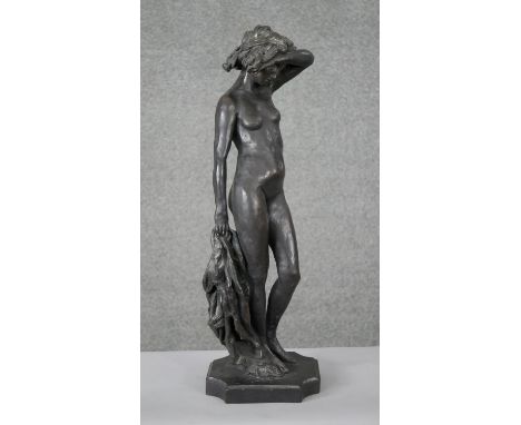 Ron Moll- A contemporary bronzed cold cast resin figure of a nude woman holding a cloth. Signed R. Moll, numbered 239/250. H.