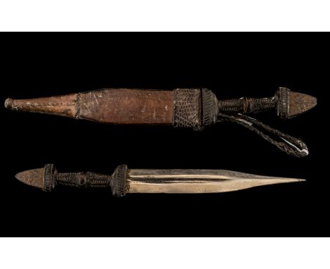 Antique North African Arab Dagger of Fine Quality. The Leather Scabbard Finely tooled with a Geo-Metric Design, Supported wit