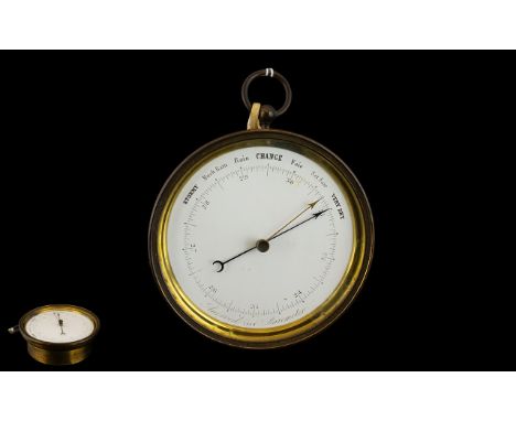Antique FIne Quality Brass Cased Aneroid Ships Barometer. Number 62. With a White Enamel Dial and Ring Hook Fitted to the Cas