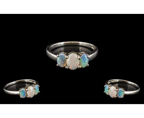 Ladies 3 Stone Set Opal Ring In Silver. Opals are of Good Size and Colour. Hallmarked for Silver. Please See Photo. 