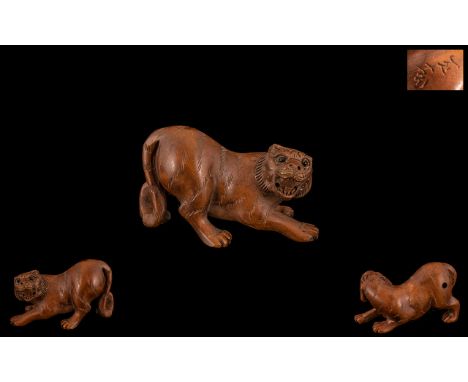 Modern Netsuke In Boxwood In the Form of Tiger / Cougar. Wonderful Detail, Signed to Base and Has Glass Eyes. 