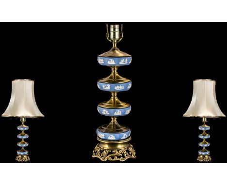 A 20thC Wedgwood Ormolu Mounted Lamp of Unusual Form four tier base raised on brass plinth. Height including shade 29 inches.