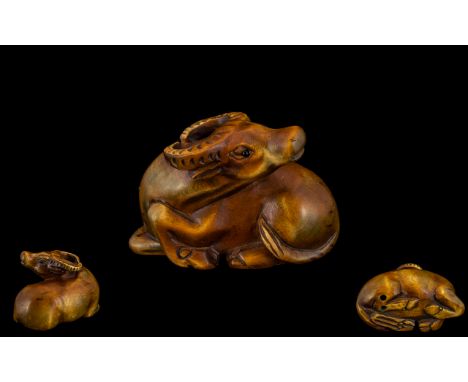 Modern Netsuke In Boxwood In Form of a Sitting Water Buffalo. Great Detail In All Aspects, Glass Eyes. Please See Photo. 