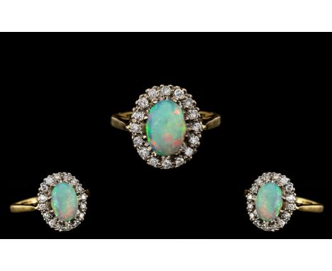 Antique Period - Attractive 18ct Gold Opal and Diamond Set Ring. Flower head Design In a Gallery Setting. The Oval Shaped Opa