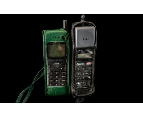 Two Vintage Cell Phones (Retro) - Nokia CM/H.333 in original leather cases.