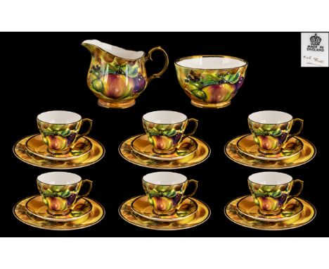 A Royal Worcester Style Part Teaset comprising of 6 large cups and saucers and sideplates, sugar bowl and milk jug. Still lif