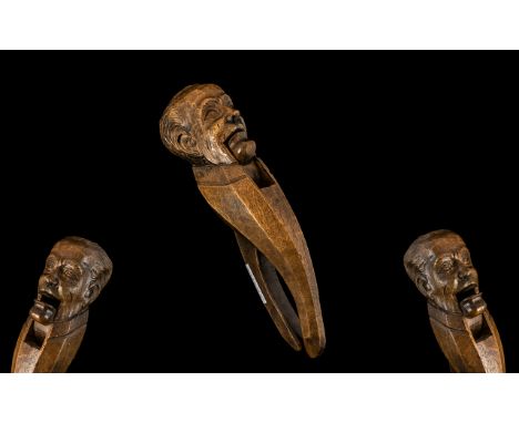 Black Forest Interest.  Large Carved Figural Nutcracker in the form of a gentleman of typical style.  Length 10''.